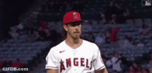 Man In White Suit Holding Sword GIF