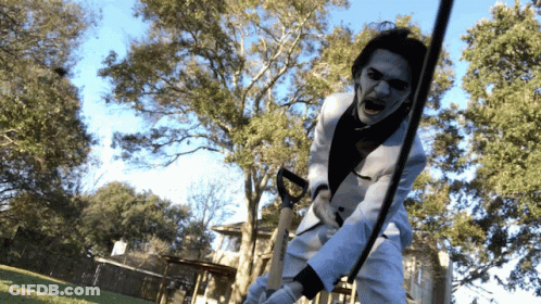 Man In White Suit Holding Sword GIF