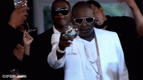 Man In White Suit Holding Water GIF
