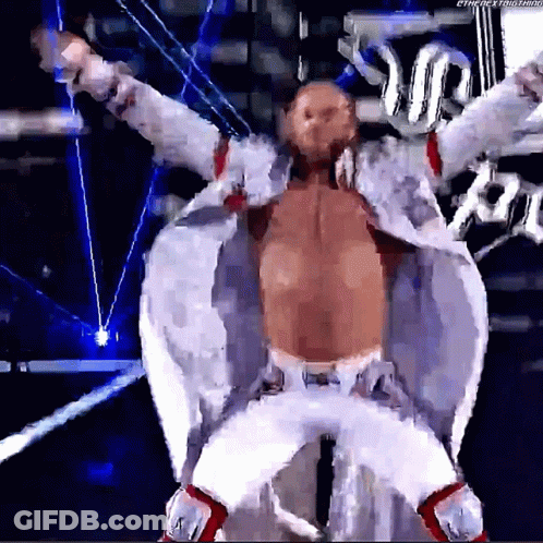 Man In White Suit In Front Of Rumble Sign GIF