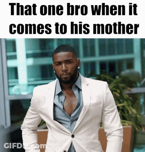 Man In White Suit In Front Of Sign That One Bro When It Comes To His Mother GIF