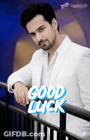 Man In White Suit Leaning On Railing Saying Good Luck GIF