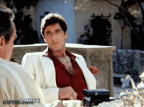 Man In White Suit Next To Man In Red Shirt GIF