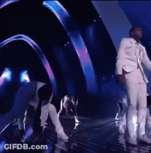 Man In White Suit On Stage GIF