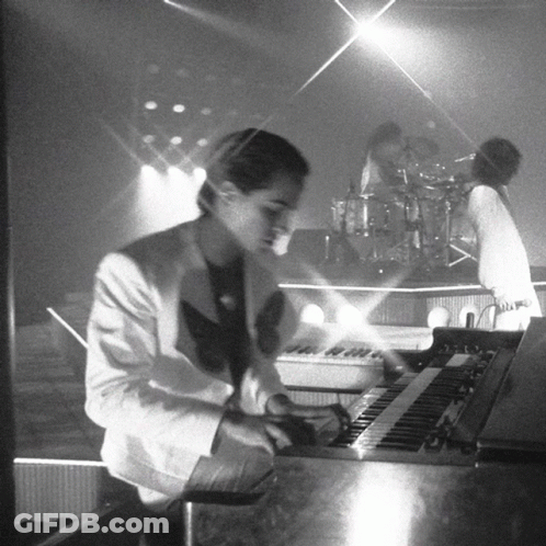 Man In White Suit Playing Keyboard GIF
