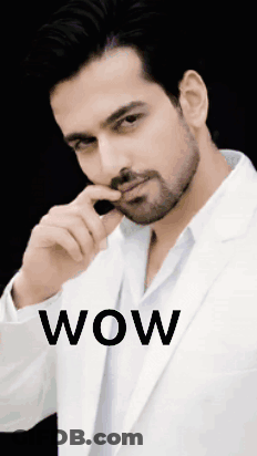 Man In White Suit Saying Wow GIF