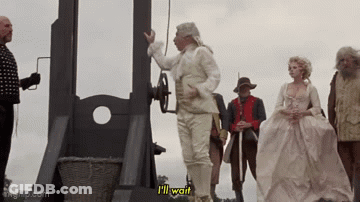Man In White Suit Says I'll Wait At Guillotine GIF
