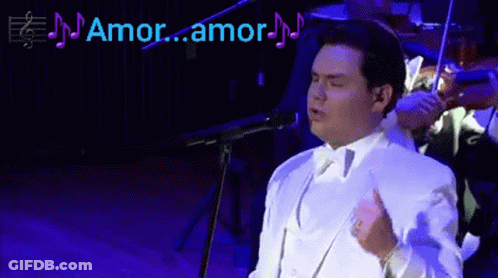 Man In White Suit Singing Amor Amor GIF