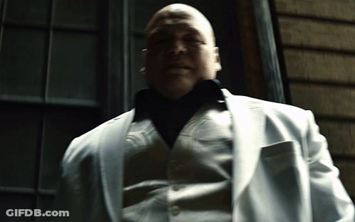 Man In White Suit Sitting With Eyes Closed GIF