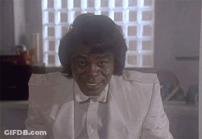 Man In White Suit Smiling GIF