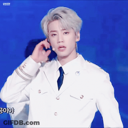 Man In White Suit Talking On Phone GIF