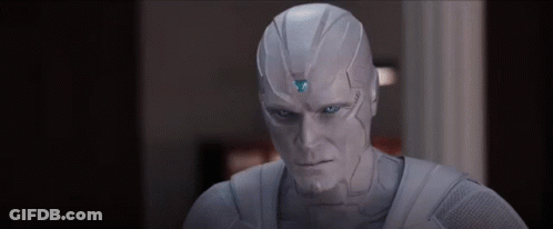 Man In White Suit With Blue Eye And Triangle GIF