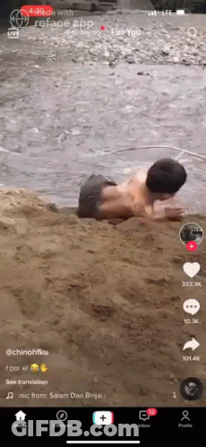 Man In White Suit With CC On Wall GIF