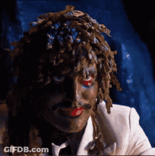Man In White Suit With Wig And Red Lips GIF