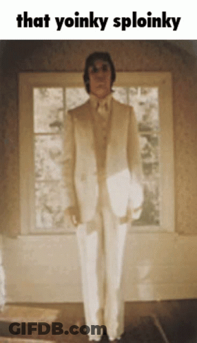 Man In White Suit With Yoinky Sploinky GIF