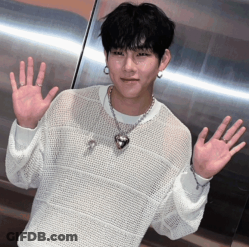 Man In White Sweater And Heart Shaped Necklace GIF