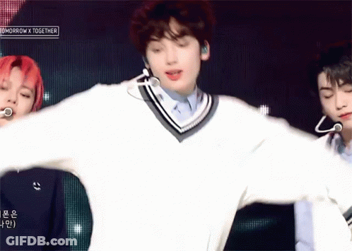 Man In White Sweater Dancing On Stage GIF