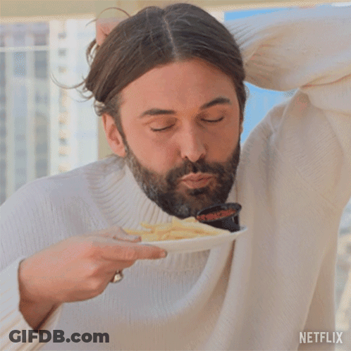 Man In White Sweater Eating Fries With Netflix Logo GIF