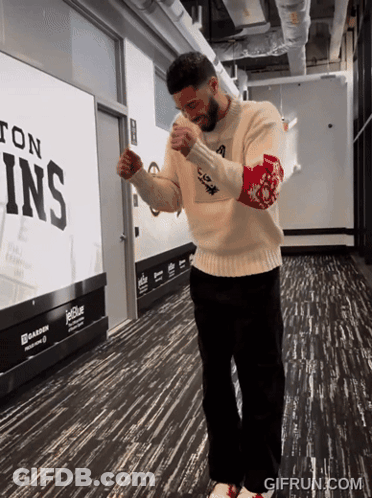 Man In White Sweater Near JetBlue Sign GIF