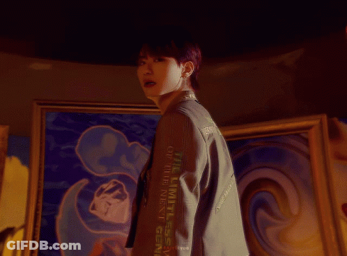 Man In White Sweater Sitting On Stool GIF