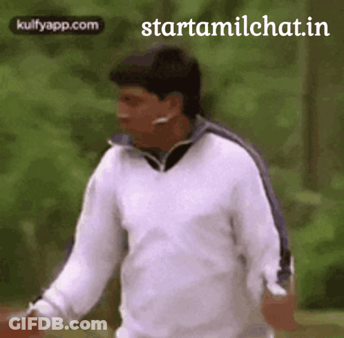 Man In White Sweater Walking In Park GIF