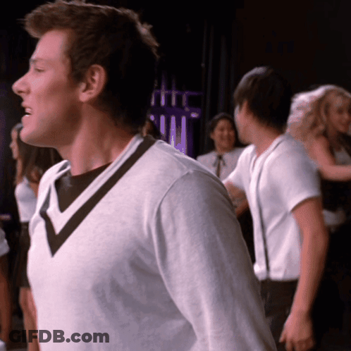 Man In White Sweater With Black V-Neck GIF