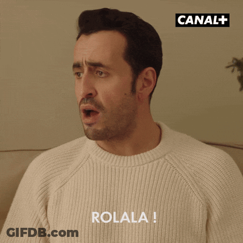 Man In White Sweater With Rolala GIF