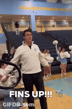 Man In White Sweatshirt Says Fins Up With Cheerleaders GIF