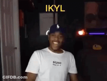 Man In White T-Shirt And Blue Hat Smiling Dancing GIF