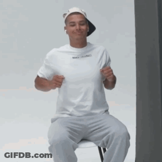 Man In White T-Shirt And Hat Smiling GIF