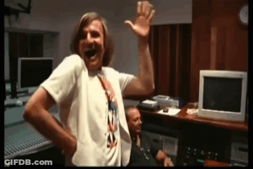 Man In White T-Shirt Laughing And Waving GIF