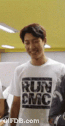 Man In White T-Shirt Saying Run DMC Smiling GIF