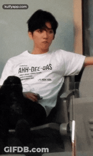 Man In White T-Shirt Sitting GIF