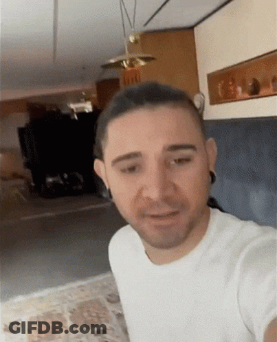 Man In White T-Shirt Taking Selfie GIF