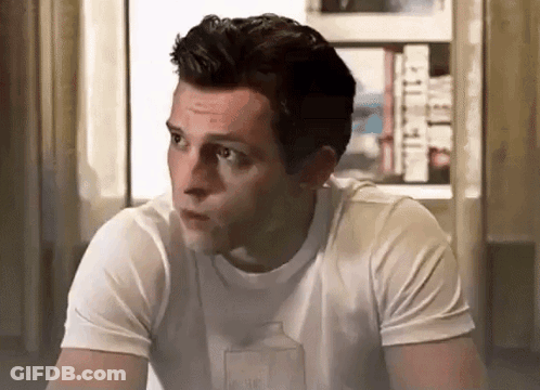 Man In White T-Shirt With Milk Carton Sitting By Window GIF