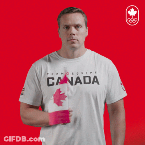 Man In White T-Shirt With Word Canada Holding Flag GIF