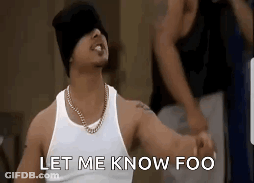 Man In White Tank Top And Black Beanie Saying Let Me Know Foo GIF