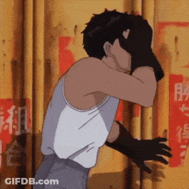Man In White Tank Top And Black Gloves Covering Face GIF