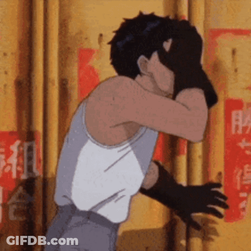 Man In White Tank Top And Black Gloves Covering Face GIF