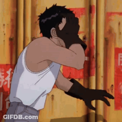 Man In White Tank Top And Black Gloves Facing Yellow Wall GIF