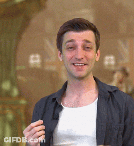 Man In White Tank Top And Black Jacket Smiling GIF