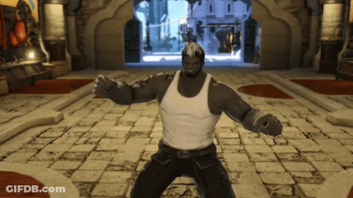 Man In White Tank Top And Black Pants On Brick Floor GIF