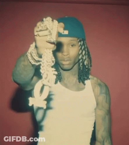 Man In White Tank Top And Blue Hat Holding Chain With Letter O GIF
