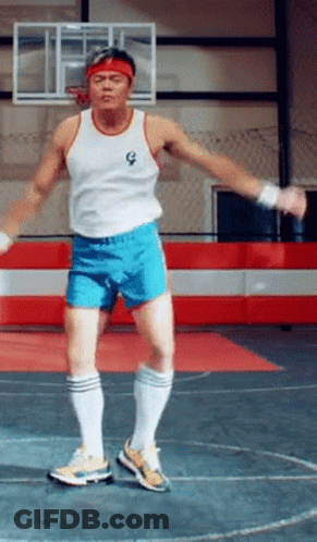 Man In White Tank Top And Blue Shorts Jumping GIF