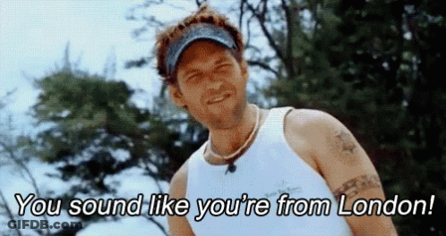 Man In White Tank Top And Hat Saying You Sound Like You're From London GIF
