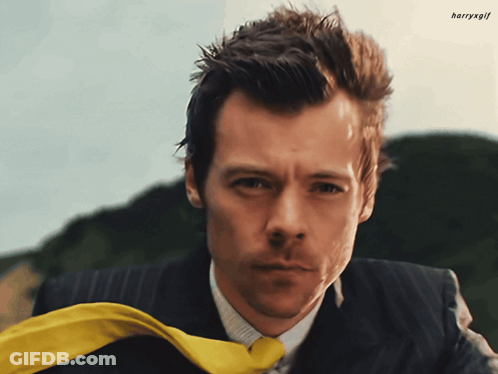 Man In White Tank Top Being Held By Another Man GIF