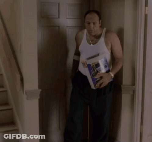 Man In White Tank Top Carrying Box With Bottle GIF