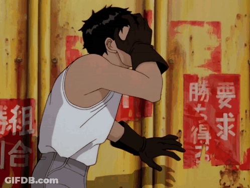 Man In White Tank Top Covering Face Before Yellow Wall With Chinese Writing GIF