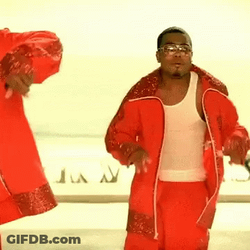 Man In White Tank Top Dancing By Plane With Letter A GIF