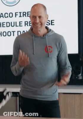 Man In White Tank Top Dancing In Front Of Crowd GIF